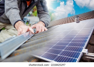 Roofer, Worker On The Rooftop. Roofing Work. Solar Cell Installation. Preparation Of Solar Panel Installation. Attaching Rails On Construction Site