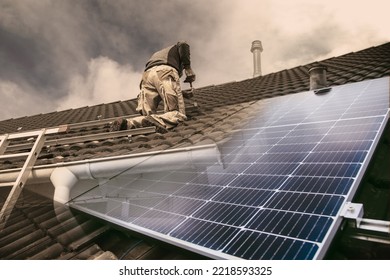 Roofer, Worker On The Rooftop. Roofing Work. Solar Cell Installation. Preparation Of Solar Panel Installation. Attaching Rails On Construction Site