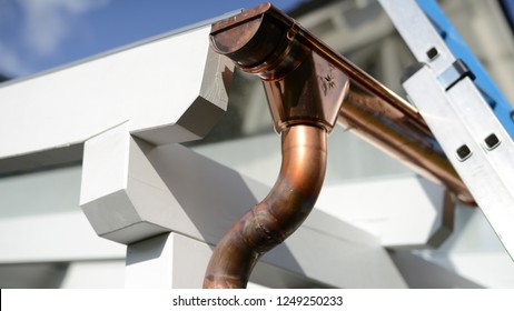 roofers work: Copper gutter with spigot and 2 arches