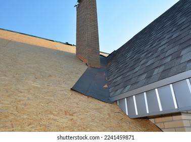 Roofing Construction with Asphalt Shingles corner waterproofing. Close up on laying asphalt shingles in the house attic rooftop corner problem area. Repair asphalt shingles attic roof. - Shutterstock ID 2241459871