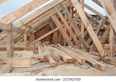 Roofing construction and framing of a new house. Timber trusses, roof framing with a close-up of roof beams, framing, ceiling joists,  struts and rafters. 
