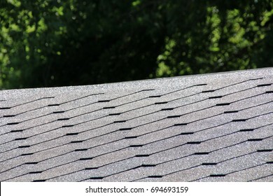 Roofing Flexible Fiberglass Asphalt Shingles On A Modern Pavilion Roof In The Summer Garden