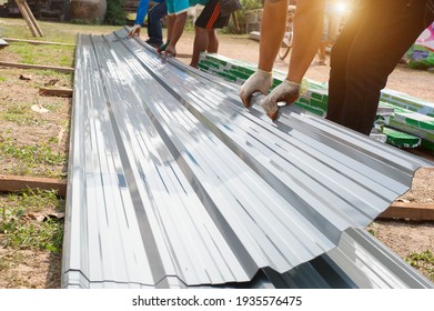 
Roofing workers used metal sheets on the roof of the house.