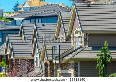 Roofs of a modern houses in great neighborhood, in suburbs of Vancouver, Canada.