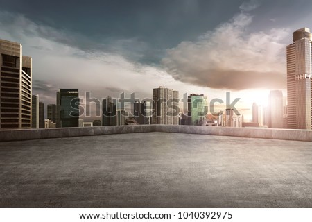 Rooftop balcony with cityscape at sunset
