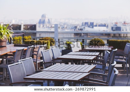 rooftop cafe, open terrace with wooden tables
