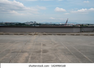 Rooftop Carpark With Cloudy Sky