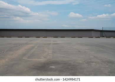 Rooftop Carpark With Cloudy Sky