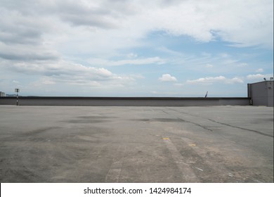 Rooftop Carpark With Cloudy Sky