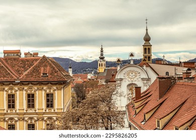 Rooftop cityscape view with church towers of Graz City, Austria, in early spring outdoors
