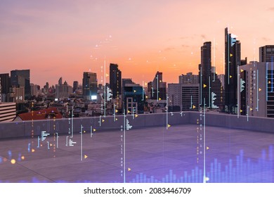 Rooftop with concrete terrace, Bangkok sunset skyline. Forecasting and business modeling of financial markets hologram digital charts. City downtown. Double exposure.