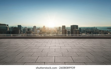 Rooftop empty brick floor with panoramic city skyline during sunrise.