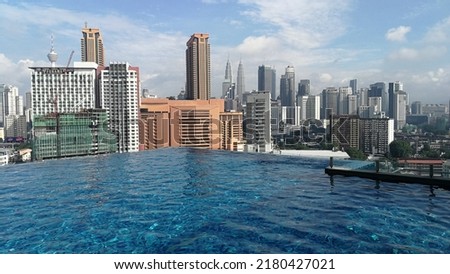 Rooftop infinity pool with view of Petronal Towers in Kuala Lumpur malaysia