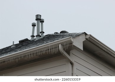 Rooftop Plumbing Vents in the Snow - Powered by Shutterstock