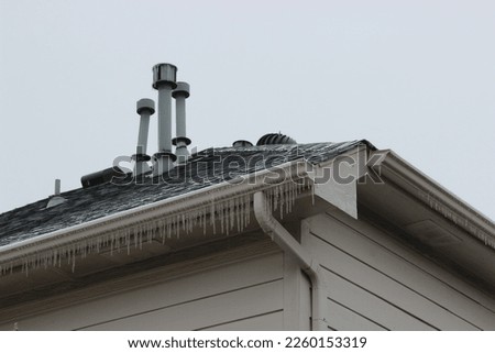 Rooftop Plumbing Vents in the Snow