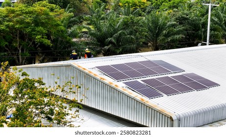 Rooftop solar installation project with workers ensuring the setup of photovoltaic panels, emphasizing clean energy, environmental responsibility, and green technology in a serene landscape.