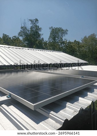 Rooftop solar panel installation on a metal roof. Harnessing clean energy under clear skies. Ideal for residential or agricultural power solutions. Get your solar system today! #SolarEnergy #Renewable