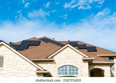 Rooftop Solar Panels on nice new home in Austin Texas providing clean sustainable and renewable energy - Shutterstock ID 2187376203