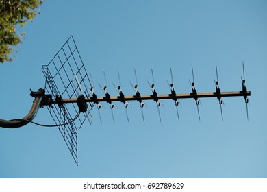 Rooftop Tv Antenna Against Blue Sky