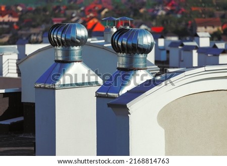 Rooftop ventilation . Exhaust vents on the building roof top 