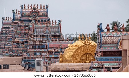 Rooftop view of part of the temple complex dedicated to Ranganatha, an avatar of Vishnu, at Trichy which is the largest such Hindu compound in India. The golden roof caps the inner sanctum, or Vimana