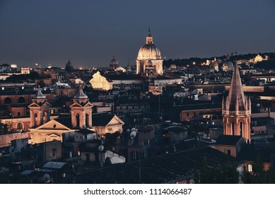 Rooftop View Of Rome Historical Architecture And City Skyline At Night. Italy.