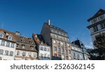 The rooftops of French apartment buildings in the historical district of Strasbourg, Alsace. Charming architecture highlighting real estate properties in the area