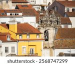 Rooftops of the town of Coimbra and the old bell tower of St. Bartholomew church.