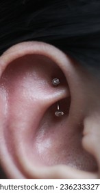 Rook piercing on model ear