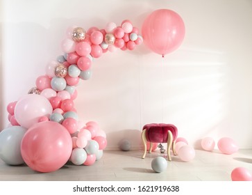 Room decorated with colorful balloons for party