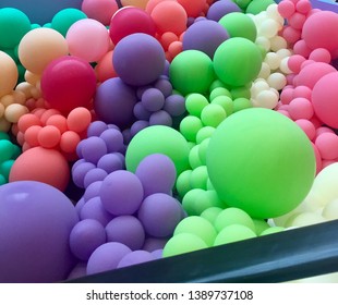 Room Full Of Balloons In Various Shapes And Colors 