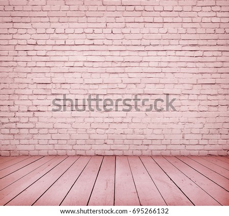 Room interior with pink brick wall and wooden floor