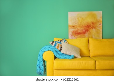 Room Interior With Sofa On Color Wall Background