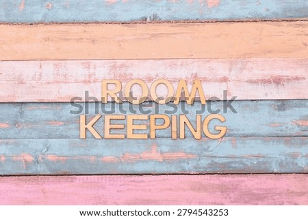 room keeping write on rustical wooden background 