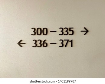 Room Number Sign On The Wall In The Hotel From 300 To 335 And 336 To 371