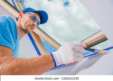 Room Painter In Action. Painting Apartment Interior With New Bright Paint. Construction Industry Theme. Caucasian Men In His 30s.