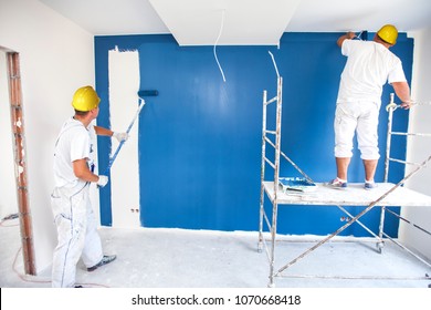 Room Painter Paints A Wall In A New Home. Unrecognizable Person.