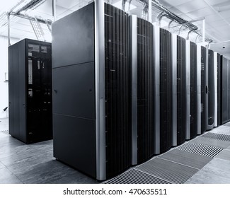 room with rows of modern supercomputers in data center