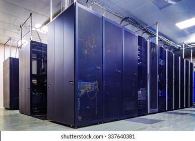 room with rows of server hardware in the data center