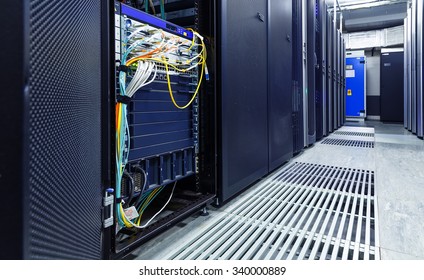 room with rows of server hardware in the data center