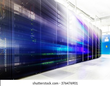 room with rows of server hardware in the data center