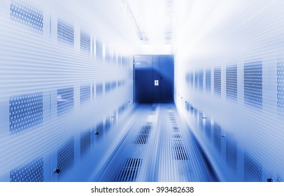 room with rows of server hardware in the data center