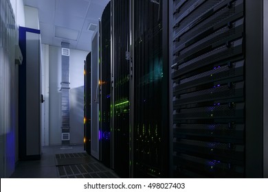 room with rows of server hardware in the data center