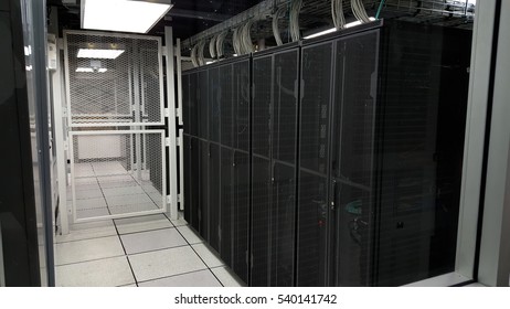 room with rows of server hardware in the data center