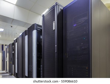 room with rows of server hardware in data center