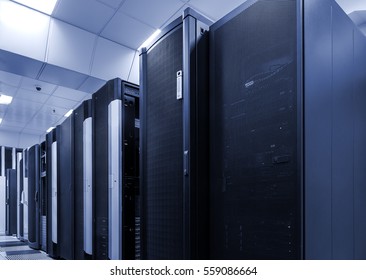 room with rows of server hardware in data center