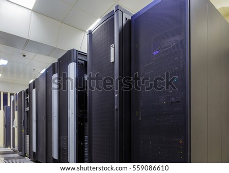 room with rows of server hardware in data center