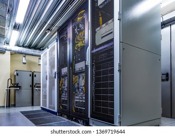 Room with server rack of hardware, cloud storage in big data center