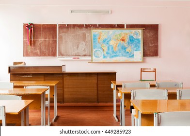 Room For Teaching Geography At School With A Map On The Wall.