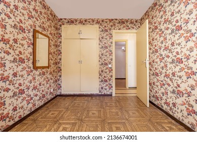 Room With Walls Wallpapered With Vintage Kitsch Red Flowers And Cabinets And Doors Painted In Cream Color